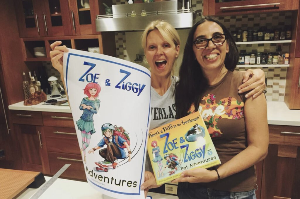 Caroline and Andrea celebrating first proof print of book 1.